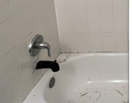 Worn tub and walls before reglazing