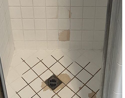 Stained shower pan before reglazing