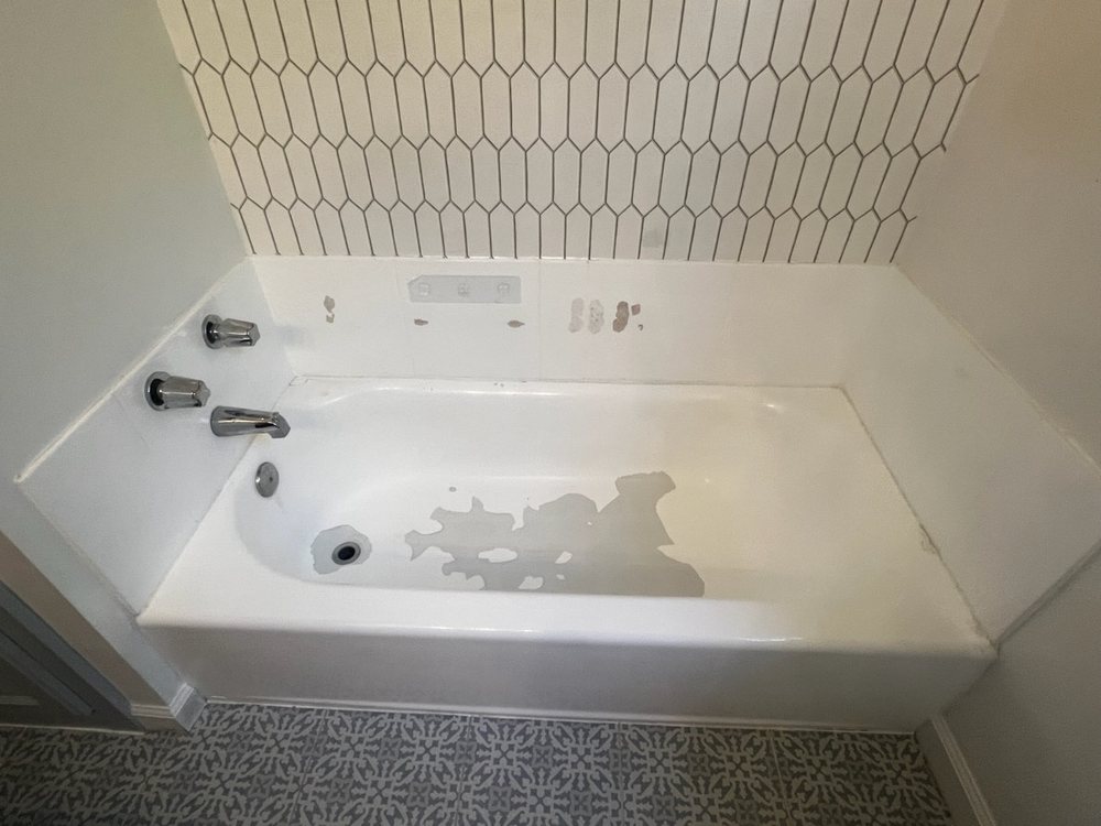 Worn, stained fixture before reglazing