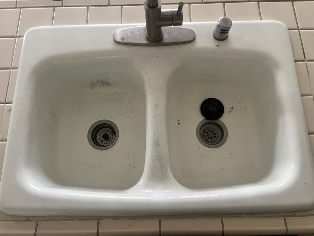 Worn, stained fixture before reglazing